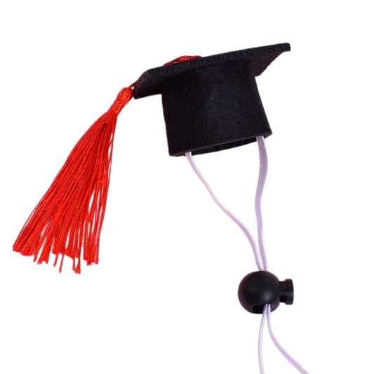 Detailed product view of the adjustable felt pet graduation hat with a royal blue tassel on a white background.