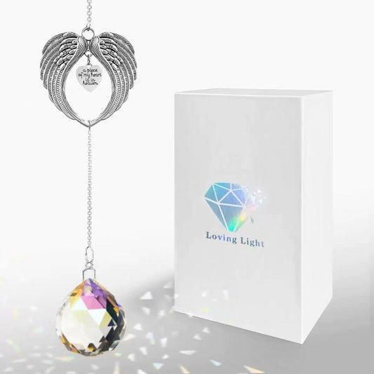 Pet memorial crystal suncatcher in gift box with rainbow prism light, angel wings heart design