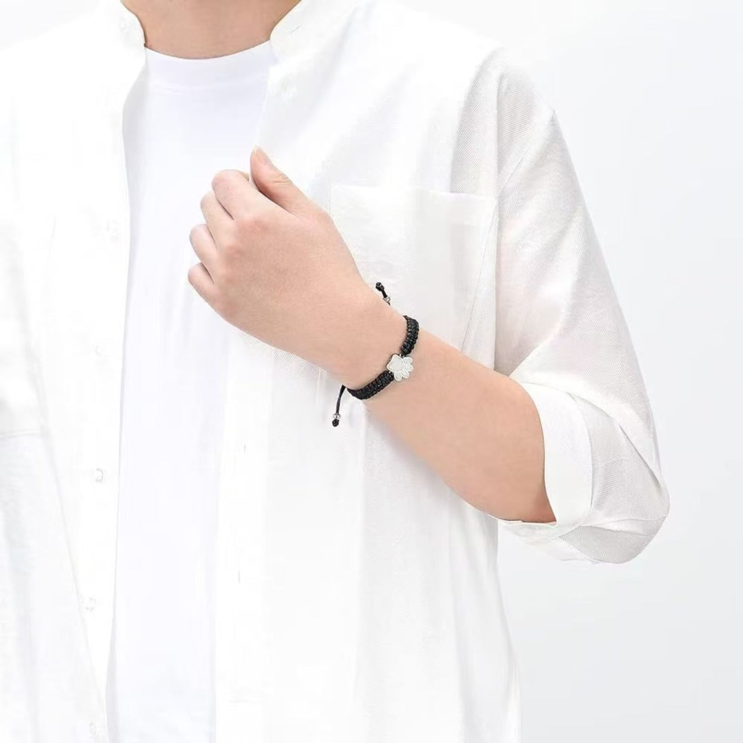 Unisex paw cremation bracelet worn on wrist minimal braided memorial jewelry