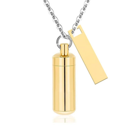 Gold alloy capsule pet urn necklace with matching black tag on silver chain front view