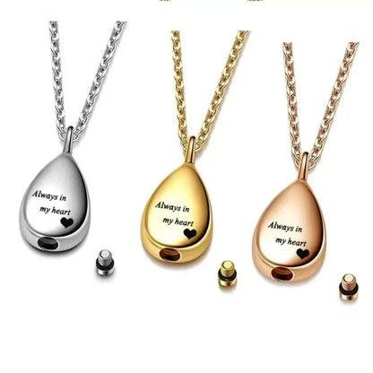 Silver, gold and rose gold teardrop urn pendants with screw closure pieces shown