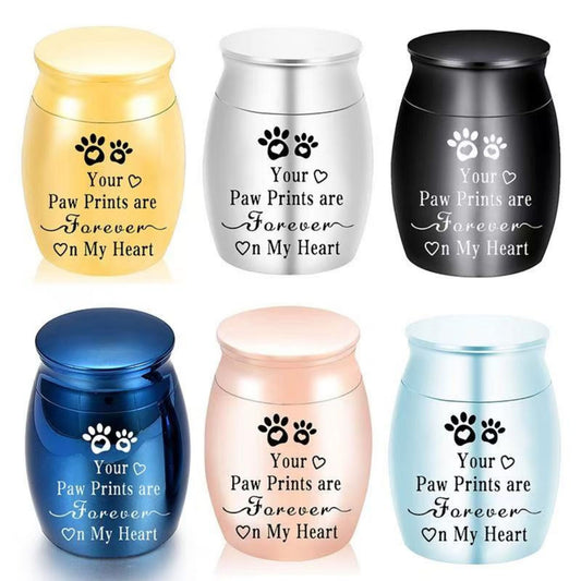 Paw Prints “Forever On My Heart” mini pet keepsake urn shown in multiple colors (gold, silver, black, blue, rose gold, light blue)