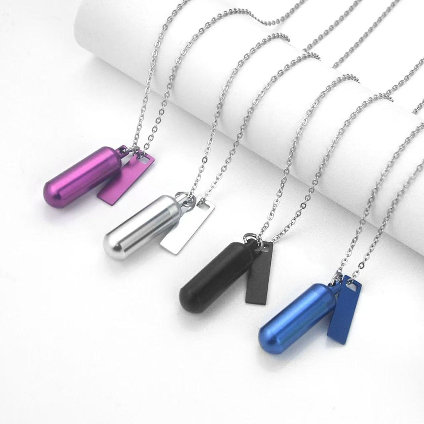 Six-color capsule keepsake keychain set with matching rectangular tags and rings