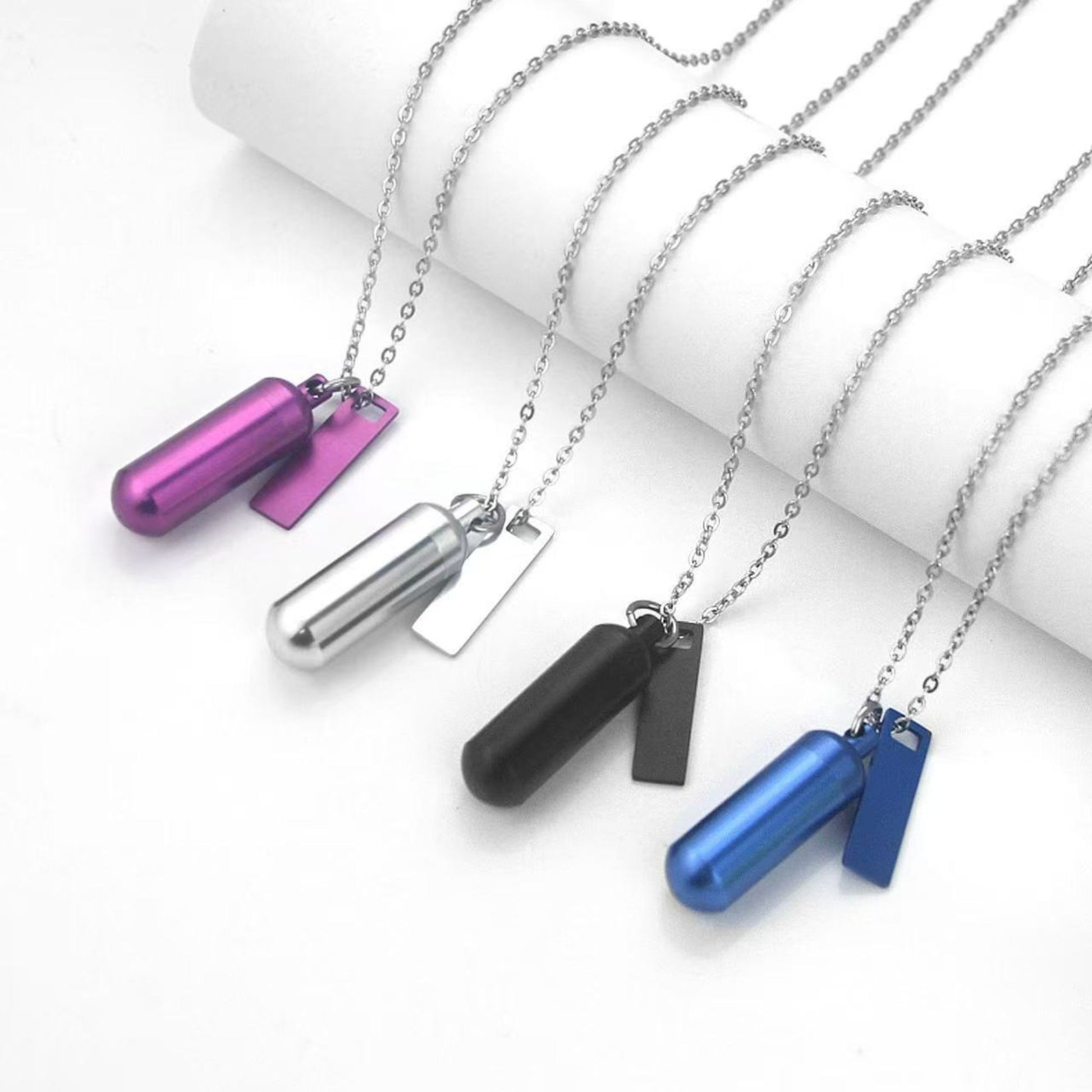 Six-color capsule keepsake keychain set with matching rectangular tags and rings