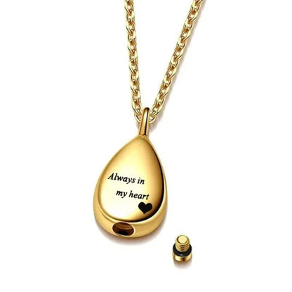 Gold teardrop urn pendant opened to show screw-top compartment and closure detail