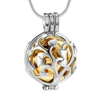Close-up of gold inner sphere Tree of Life hollow memorial pendant necklace on chain