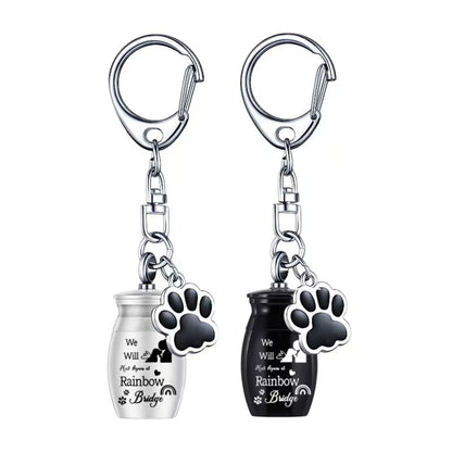 Stainless steel pet memorial urn keychain with paw charm in silver and black color options, Rainbow Bridge design, single-item variants