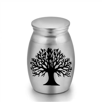 Close-up of stainless steel mini pet keepsake urn with life tree design