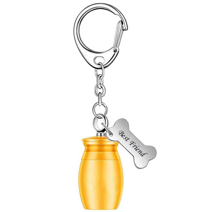 Single gold mini pet memorial urn keychain on white background with bone charm and lobster clasp keyring.