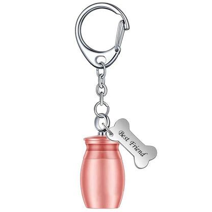 Single rose gold mini pet memorial urn keychain on white background with bone charm and lobster clasp keyring.