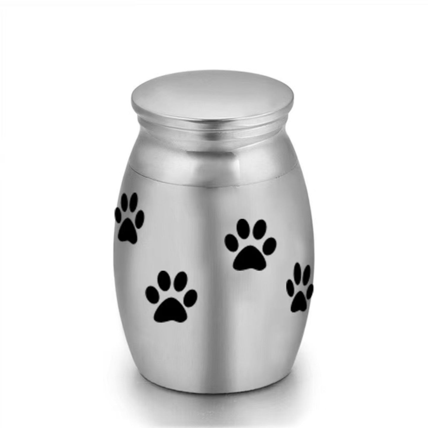 Close-up of stainless steel mini pet keepsake urn with paw prints design