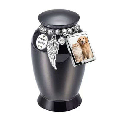 Black pet keepsake urn with photo frame charm and memorial charm bracelet for ashes or fur