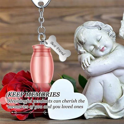 Rose gold pet memorial urn keychain lifestyle photo with angel figurine and rose, featuring Best Friend bone charm.