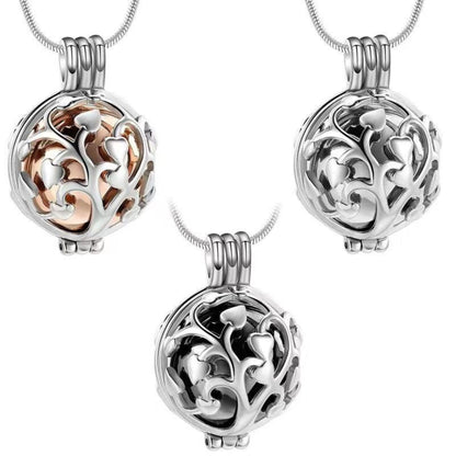 Tree of Life urn necklace displayed open with inner keepsake container parts on a white background