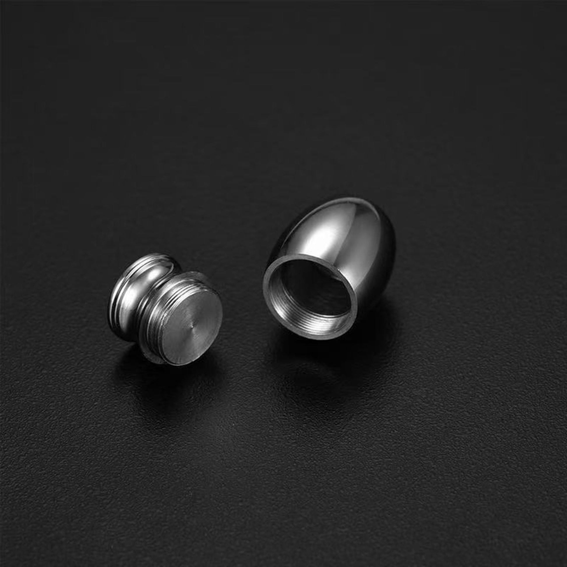 Close-up of threaded screw-on lid and interior compartment of the  mini urn