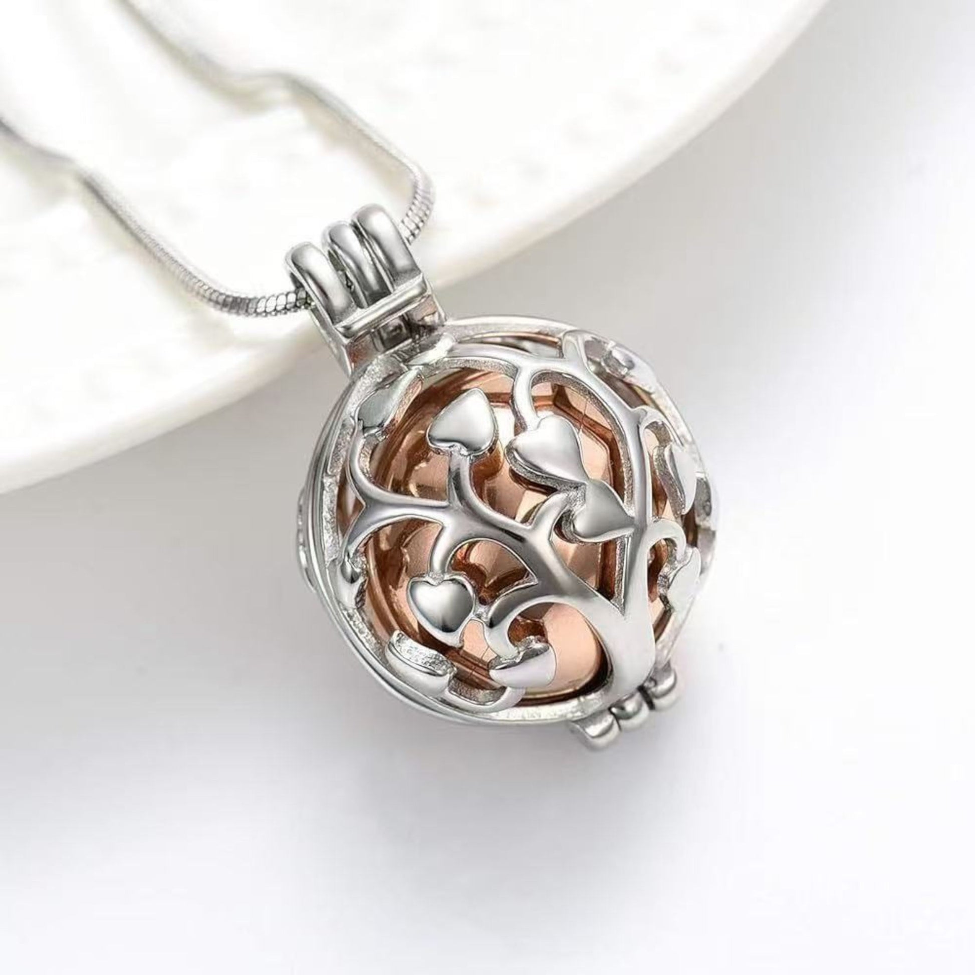 Tree of Life urn necklace displayed open with inner keepsake container parts on a white background
