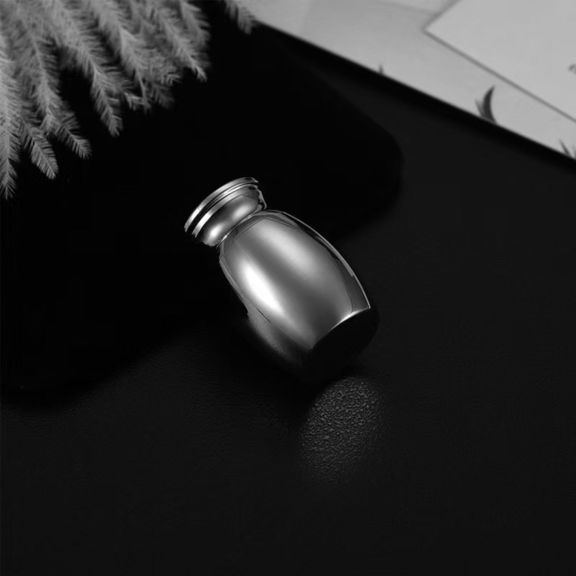  Mini black  pet keepsake urn shown  (small, discreet keepsake size)