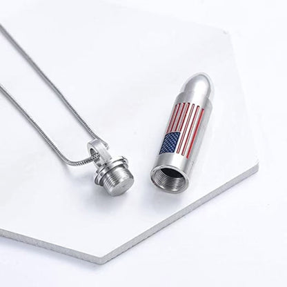 Open bullet urn pendant showing threaded screw-top compartment for ashes