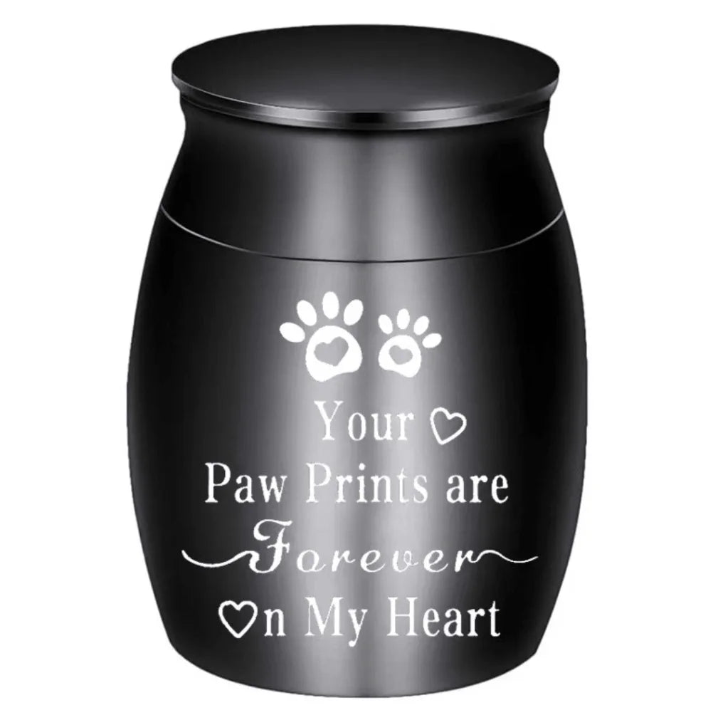 Isolated front view of the silver memorial urns for pets engraved with a heart, paw prints, and forever on my heart text.