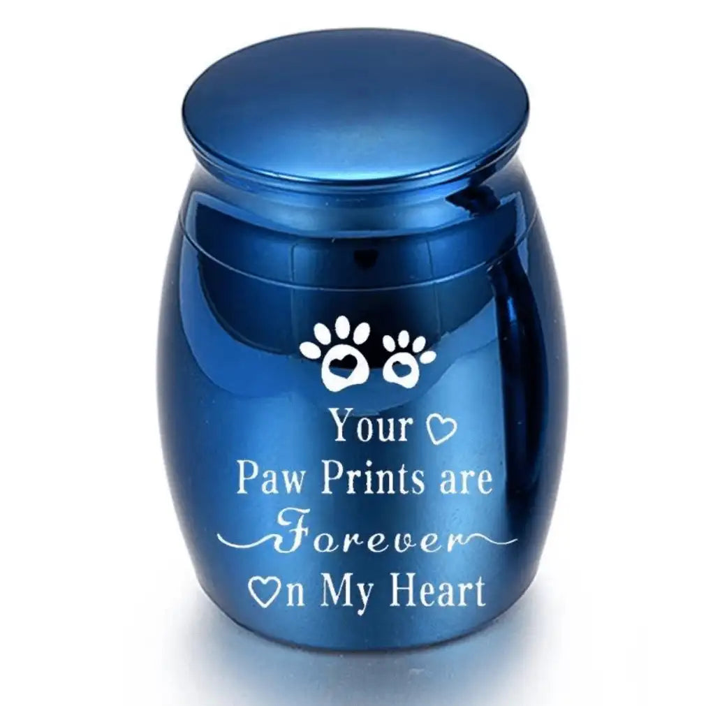 Isolated front view of the silver memorial urns for pets engraved with a heart, paw prints, and forever on my heart text.