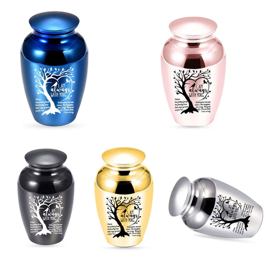 Small pet memorial urns in blue, silver, gold, black, and pink, featuring engraved tree artwork and remembrance quote for dog or cat ashes.
