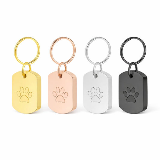  "Colorful memorial urn keychains in gold, silver, black, and rose gold with paw print charm, perfect for pet loss."