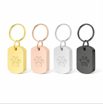  "Colorful memorial urn keychains in gold, silver, black, and rose gold with paw print charm, perfect for pet loss."