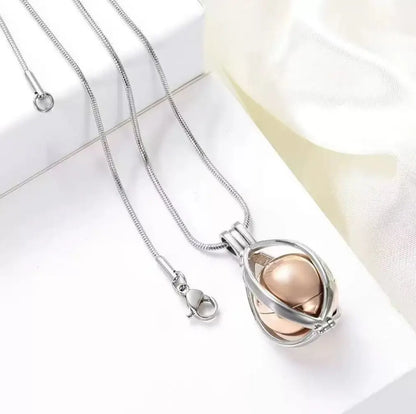 Openable teardrop cremation urn pendant necklace showing screw-top keepsake container for ashes, fur or hair 1