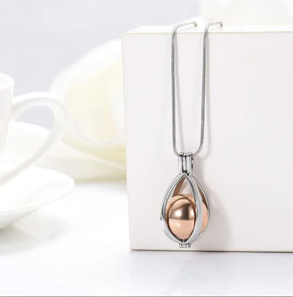 Openable teardrop cremation urn pendant necklace showing screw-top keepsake container for ashes, fur or hair 2