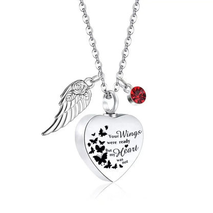 Red January garnet birthstone heart pet memorial urn necklace on a silver chain.