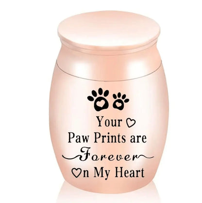 Isolated front view of the silver memorial urns for pets engraved with a heart, paw prints, and forever on my heart text.