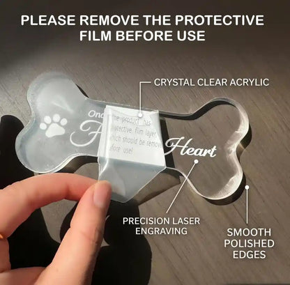 Peeling off the protective paper layer from the acrylic pet memorial plaque.