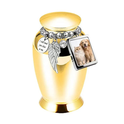 Isolated front view of the light blue personalized pet urn decorated with an emotional poetry medallion and photo frame.