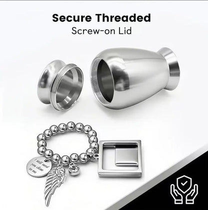 Threaded lid opening of pet urns for cremation displaying a detachable beaded charm loop with a custom photo locket.