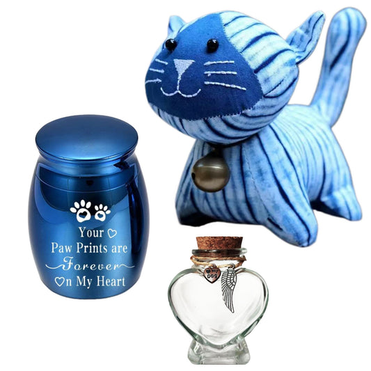Handcrafted indigo blue tie-dye cat stuffed animal toy paired with a small blue metal pet urn engraved with paw prints.