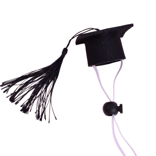 Detailed product view of the adjustable felt pet graduation hat with a royal blue tassel on a white background.