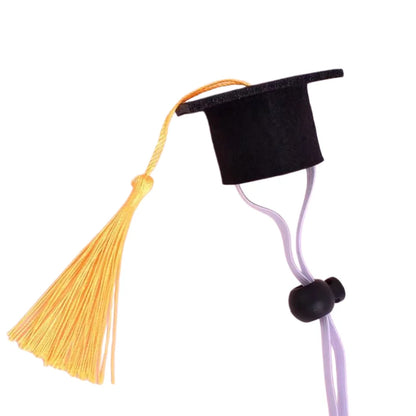 Detailed product view of the adjustable felt pet graduation hat with a royal blue tassel on a white background.