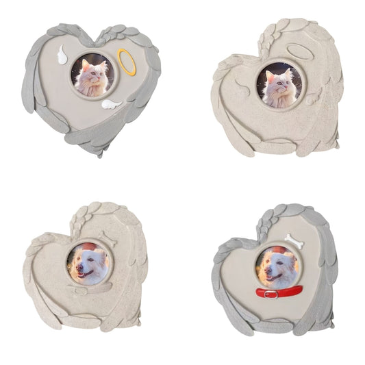Four variations of PawHalo heart-shaped pet memorial stones featuring cat and dog designs with sculpted angel wings on a white background.