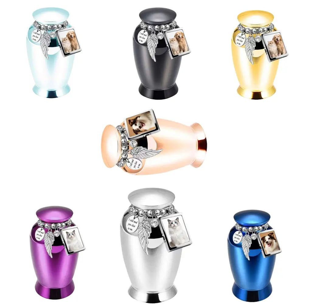 Seven beautiful metallic colors of the perfect memorials pet urns featuring a beaded charm loop and a mini photo frame.