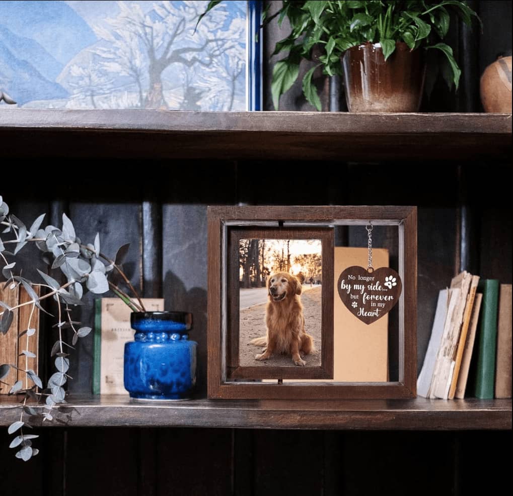 A personalized dog memorial picture frame placed beautifully on a living room shelf as a comforting home decor tribute.