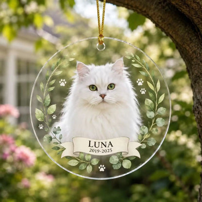 Personalized pet memorial ornament in Style I with a custom cat photo, name, years, green foliage and paw prints.