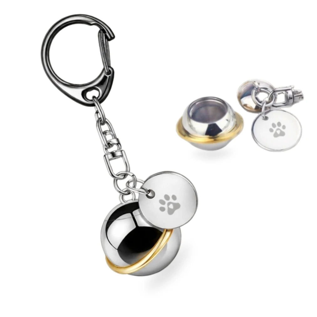 Orbit planet pet urn keychain shown assembled and unscrewed to show empty internal vault.
