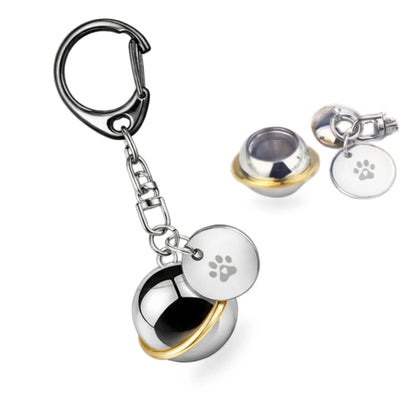 Orbit planet pet urn keychain shown assembled and unscrewed to show empty internal vault.