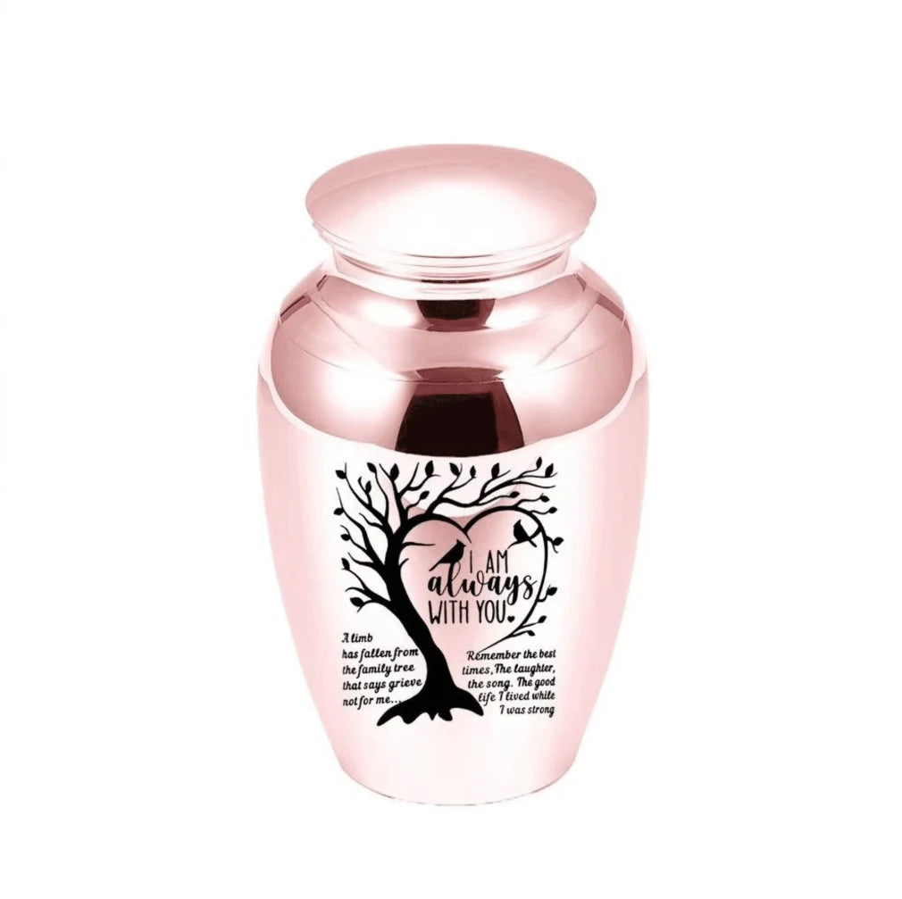 Isolated front view of the premium black stainless steel medium pet urn engraved with a heart shaped tree and birds.