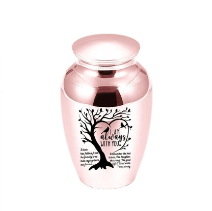 Isolated front view of the premium black stainless steel medium pet urn engraved with a heart shaped tree and birds.