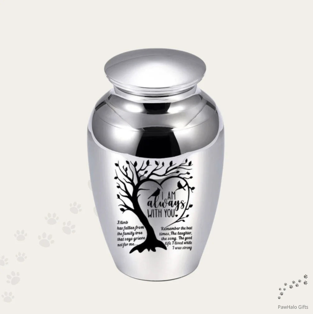 Isolated front view of the premium black stainless steel medium pet urn engraved with a heart shaped tree and birds.