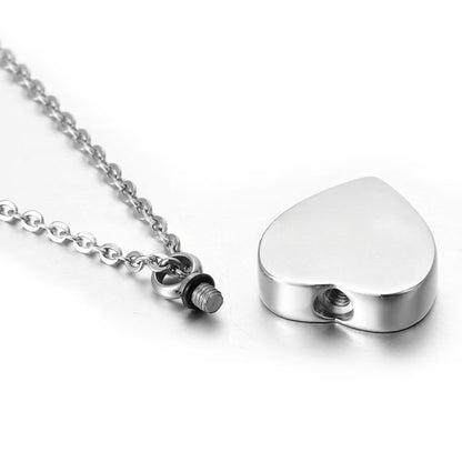 Close-up of heart urn pendant screw closure with rubber seal and threaded opening