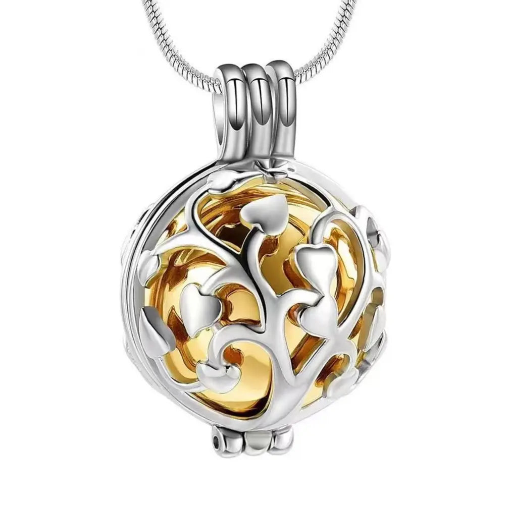 Close-up of the gold Tree of Life pet locket memorial pendant.