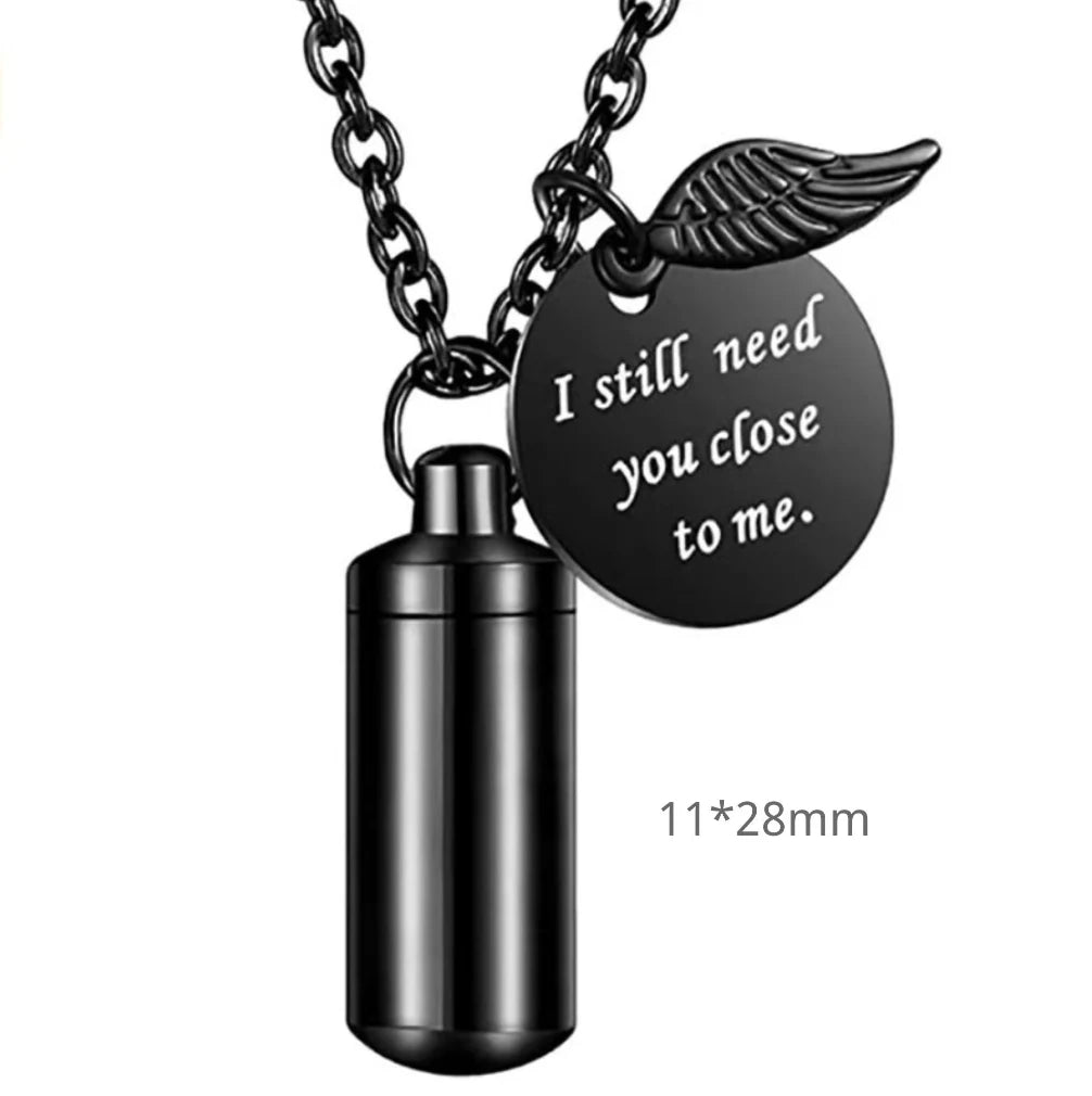 Micro 28mm size variant of the minimalist cylinder pet urn necklace in sleek midnight black.