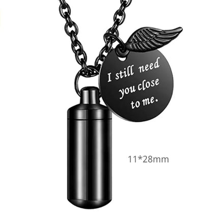 Micro 28mm size variant of the minimalist cylinder pet urn necklace in sleek midnight black.